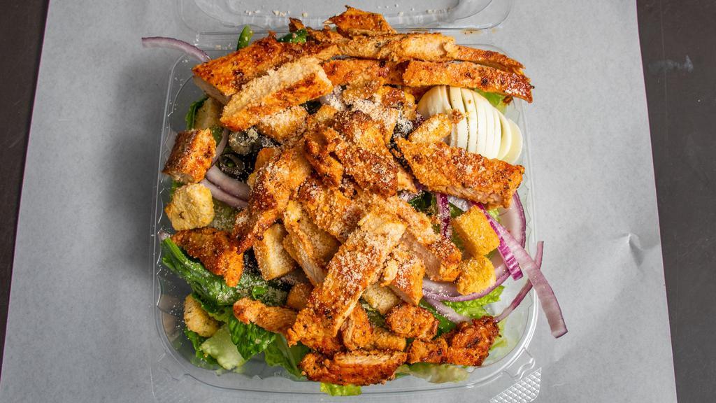 Grilled Chicken Caesar Salad · Romaine lettuce, Parmesan and croutons. Served with lettuce, tomatoes, cucumbers, onions, green peppers, hard-boiled egg, black olives, your choice of dressing and garlic bread.