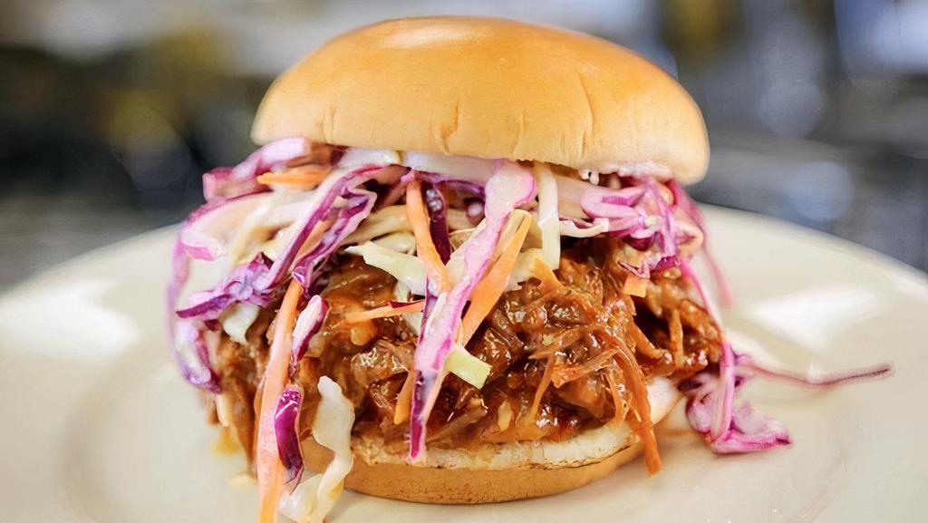 Bbq Pulled Pork Sand · In-house Smoked Pulled Pork tossed in BBQ sauce, topped with Cole slaw on a brioche bun