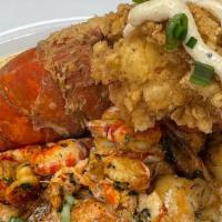 Seafood Salmon · Blackened salmon with sautéed shrimp, jumbo lump crab and lobster claw meat over spinach and...