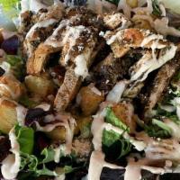 Grilled Jerk Chicken Caesar Salad · Fall greens and romain tossed in caesar dressing topped w/ house made croutons, parmesan che...