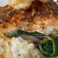 Blackened Salmon · Blackened salmon over your choice of garlic mashed potatoes or cheddar grits  with spinach t...
