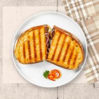 Deli Day Special Panini · Hot roast beef, turkey, melted mozzarella, tomatoes, and fried onions on toasted bread.