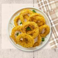 Crispy Rings · Sliced onions dipped in a light batter and fried until crispy and golden brown.