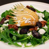 Arugula Salad · Black Mission fig, bosc pear, candied walnut, goat cheese, and cider vinaigrette.