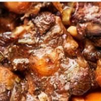 Oxtail · Oxtail is served over Rice and Peas or White Rice with Mixed Vegetables