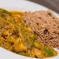 Curry Chicken · Curry Chicken is served over Rice and Peas or White Rice with Mixed Vegetables