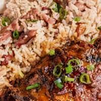 Brown Stew Chicken · Brown Stew Chicken is served over Rice and Peas or White Rice with Mixed Vegetables