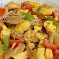 Ackee And Saltfish · Ackee and Saltfish is served over Rice and Peas or White Rice with Mixed Vegetables