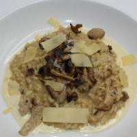 Mixed Mushroom Risotto · Arborio, truffle butter, parmesan crema.