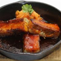 Korean Pork Belly · Spicy glaze, house-made cucumber kimchi.