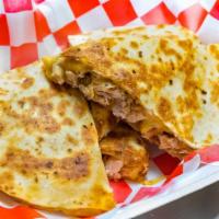 Grilled Chicken Quesadilla · Made with grilled chicken and mozzarella cheese.