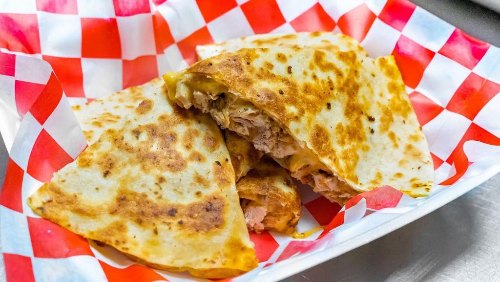 Grilled Chicken Quesadilla · Made with grilled chicken and mozzarella cheese.