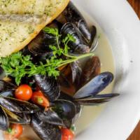 Mussels · Sauteed local mussels with tomatoes, garlic and scallions in a white wine butter broth, or f...