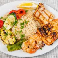 Seafood Mixed Grill · Swordfish, salmon, and shrimp in a lemon pepper sauce served with an assortment of grilled v...