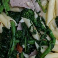 Carlos Junior · Grilled Italian sausage sauteed with garlic, white wine sauce and broccoli rabe. Served over...