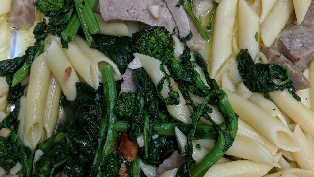 Carlos Junior · Grilled Italian sausage sauteed with garlic, white wine sauce and broccoli rabe. Served over penne pasta topped with 100% olive oil.
