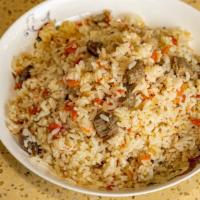 Uyghur Pilaf  · Well cooked rice with carrot ,onion and lamb