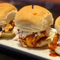 Chicken Sliders · 3 garlic soy chicken sliders topped with coleslaw and lettuce.