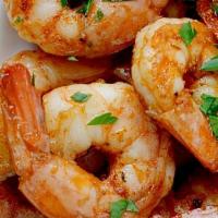 Grilled Shrimp · 12 pieces of  large shrimp grilled in butter sauce served with French Fries