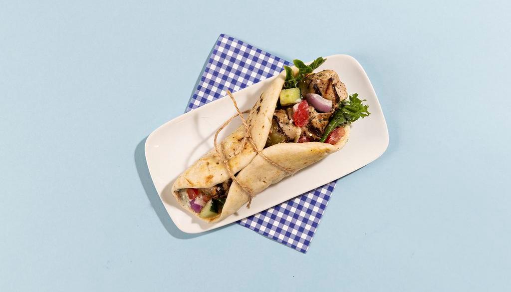 Chicken Soulvaki Pita · Grilled chicken skewer wrapped in a pita with lettuce, tomato, onion, and tzatziki.