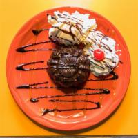 Chocolate Molton Lava Cake · Warm rich chocolate with chocolate fudge center topped with vanilla ice cream, whipped cream...