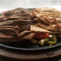 Mixta Fajitas · Sizzling tender pieces of marinated steak, chicken, or prawns sautéed with fresh bell pepper...