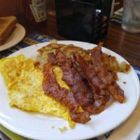 Bacon Omelette Breakfast · Served with home fries or grits, toast and jelly.