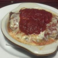 Baked Lasagna Parmigiana · Baked then topped with cheese and tomato sauce. Includes tossed salad, bread and butter.
