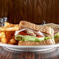 Sliced Roast Turkey Sandwich · Served on choice of bread and includes french fries.