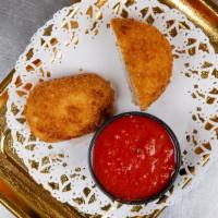 Arancini'S · Italian risotto rice ball filled with a filling then coated in breadcrumbs and deep-fried to...