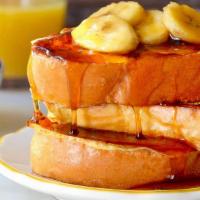 Peanut Butter Banana French Toast · Comes with three French toast, topped with sliced bananas and peanut butter, two eggs any st...