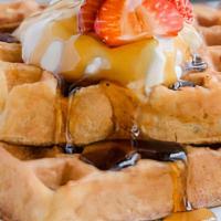 Belgian Waffle · Comes with Belgian waffle, two eggs any style and choice of meat.