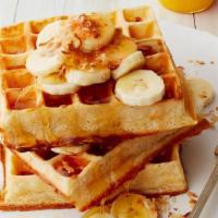 Banana Belgian Waffle · Comes with Belgian waffle, topped with sliced bananas, two eggs any style and choice of meat.