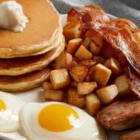 Breakfast Sampler · Belgian waffle, 2 pancakes, 3 bacon, 2 sausage, small homefries or grits and 2 eggs.