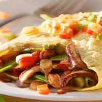 Vegetable Omelette · Three eggs with bell peppers, onions, tomatoes, mushrooms, spinach, and melted double Americ...