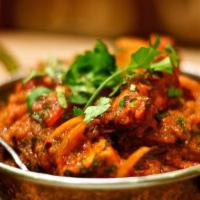 Chicken Jalfrezi · Strips of chicken marinated in fresh ground spices & cooked with the tomatoes.