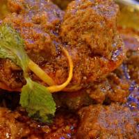 Goat Tikka Masala · Bone-in goat meat cooked tenderly & then sautted in a rich creamy tomato sauce with onions &...