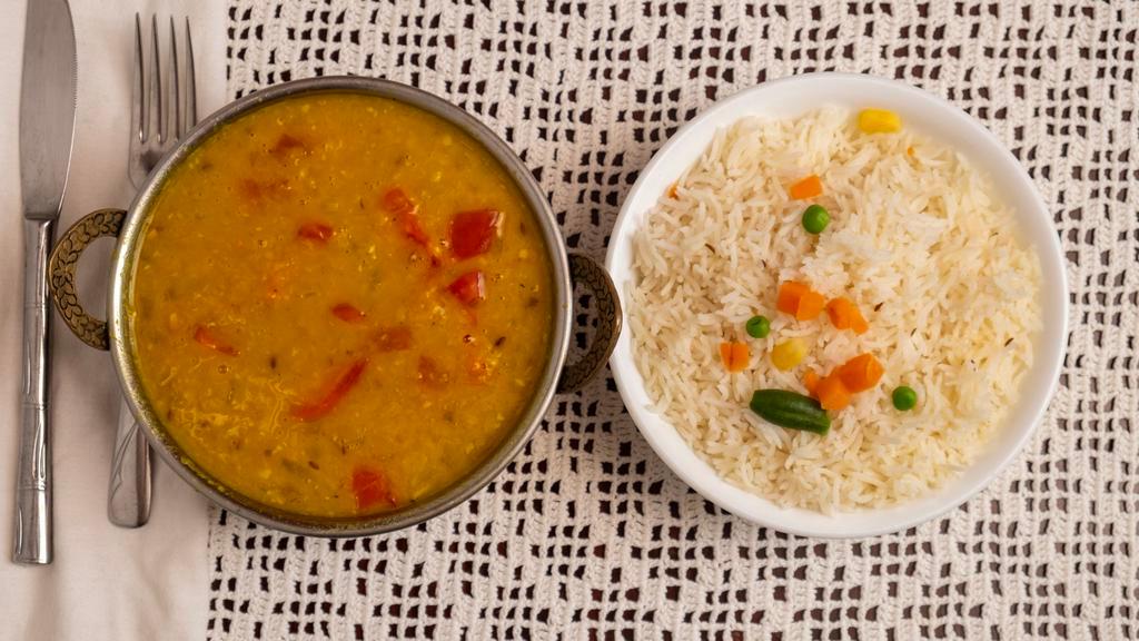 Tarka Dal · Yellow lentils tempered with butter ,whole red chillies,cumin & mustard seeds.