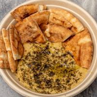 Hummus & Pita · Our house made hummus topped with olive oil and za'atar and served with pita. (Vegan.)