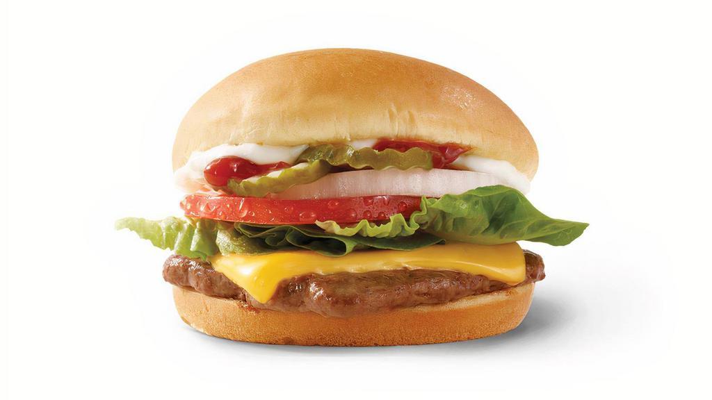 Cheeseburger Deluxe · Fresh beef topped with cheese, pickles, onions, tomatoes, crisp lettuce, ketchup, and mayo. It’s big flavor at a junior price.