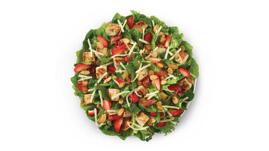 Summer Strawberry Salad · Made fresh daily with our Wendy’s signature lettuce blend, herb-marinated grilled chicken breast, a three-cheese blend of Parmesan, Asiago, and Fontina, Applewood smoked bacon, and, of course, strawberries. All topped with candied almonds and Marzetti®¿ Simply Dressed® Champagne Vinaigrette. Raise a glass because this tasty of a salad deserves a toast.