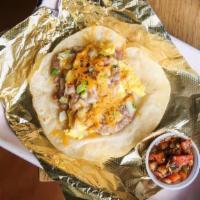 Bean & Egg Taco · refried beans w/ cheddar, onion & scrambled egg, served on housemade flour tortilla. Served ...