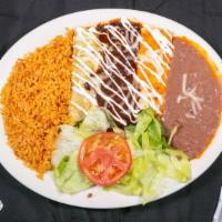 Enchiladas De Carne · Three beef enchiladas cooked with choice of red sauce, mole or green sauce with melted chees...