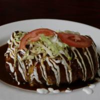 Burrito · Stuffed with rice, beans, sour cream, pico de gallo, & cheese. Topped with your choice of me...