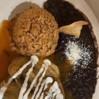 Chile Relleno · stuffed poblano pepper with cheese. toped with red sauce and sour cream