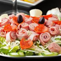 Antipasto Salad · Fresh salad with chopped cured meats, fresh cheeses and briny olives.