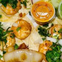 Shrimp Paisa Tacos · 3 pieces. Corn tortilla, radish, cucumbers, chopped onions, cilantro, salsa verde.
