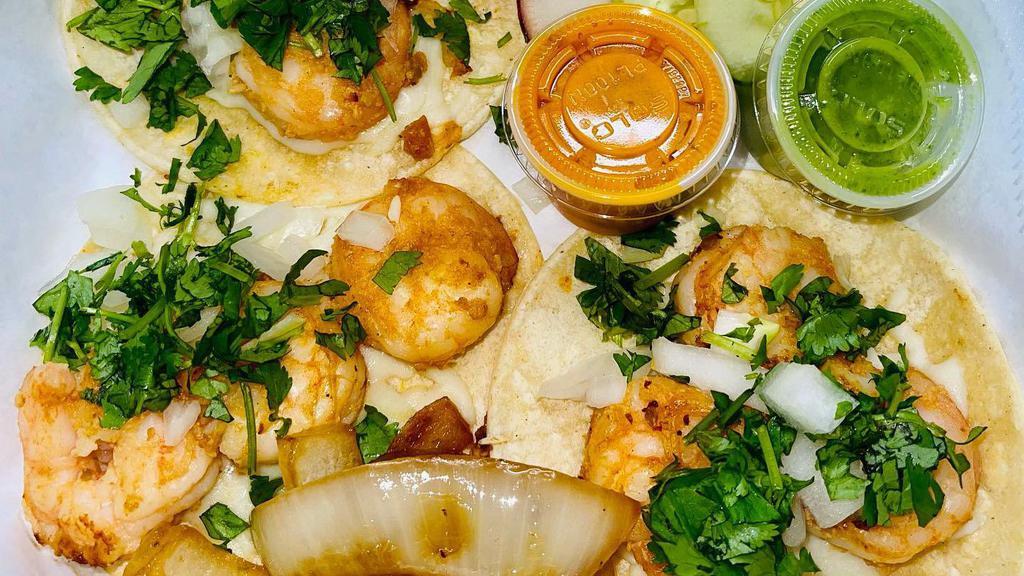 Shrimp Paisa Tacos · 3 pieces. Corn tortilla, radish, cucumbers, chopped onions, cilantro, salsa verde.