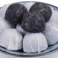 Pu-Er Tuo Cha 2Oz · earthy pellets aged at least five years / China