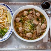 Phở With Well Done Brisket & Meatballs · Every bowl of Phở comes with gluten free rice noodles, onion, cilantro, scallion in a homema...
